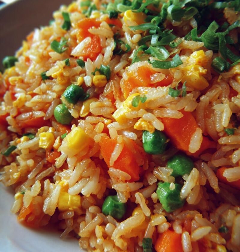Vegetable fried rice loaded with carrots, peas, corn, and scallions