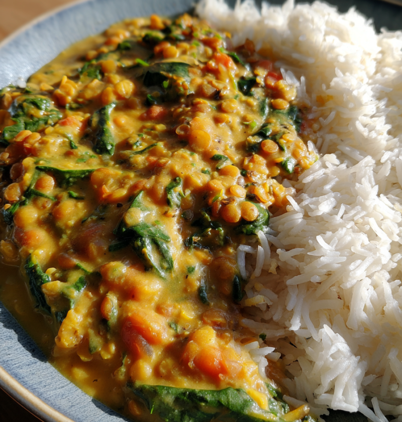 vegan lentil coconut curry with spinach and basmati rice